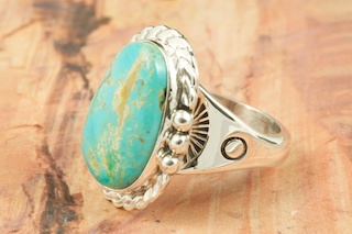 Genuine Manassa Turquoise set in Sterling Silver Ring. This Turquoise is also referred to as King�s Manassa Turquoise. The Manassa Turquoise mine is located in Manassa, Conejos County, Colorado. Created by Navajo Artist Tony Garcia. Signed by the artist.
